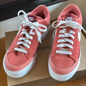 Nike Red and White suede Sneakers Classic Low-Top Design. Almost new. Size 9 W.